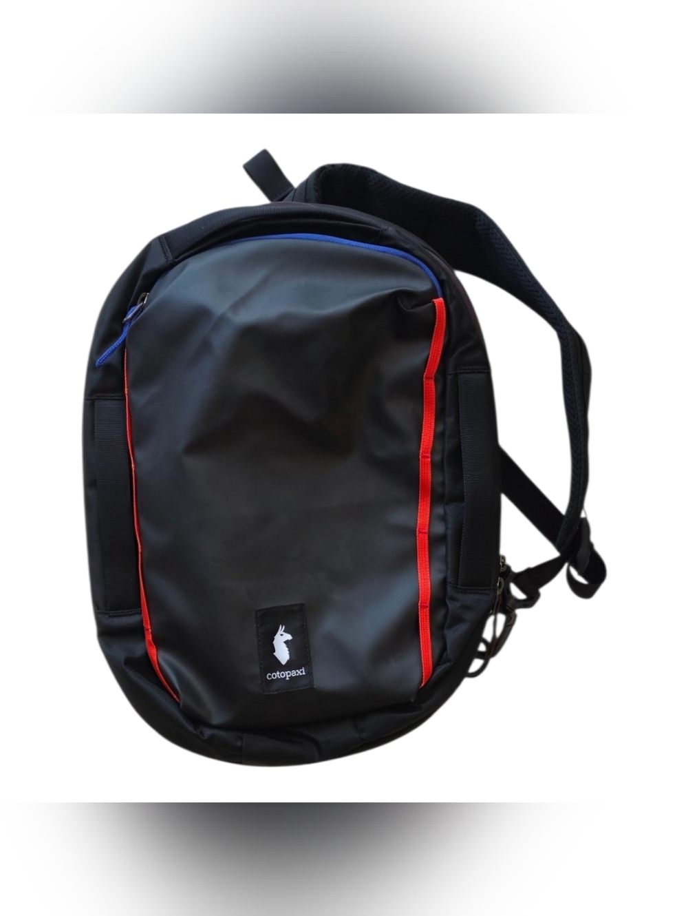 cotopaxi Black Backpack with Red Trim and Blue Zipper Accent